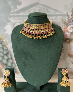 Antique gold peacock choker set with ruby and white kundan lattice, gold ghungroo fringe and matching jhumka earrings