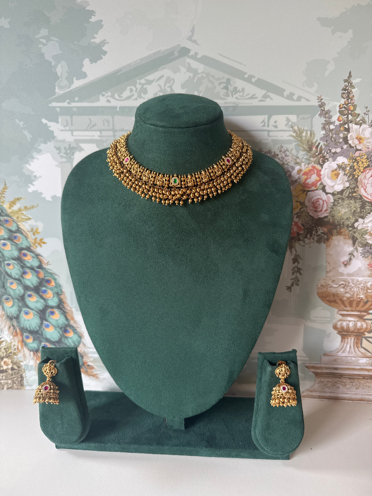 Antique gold temple jhumkas with Lakshmi stud and gold bead fringe