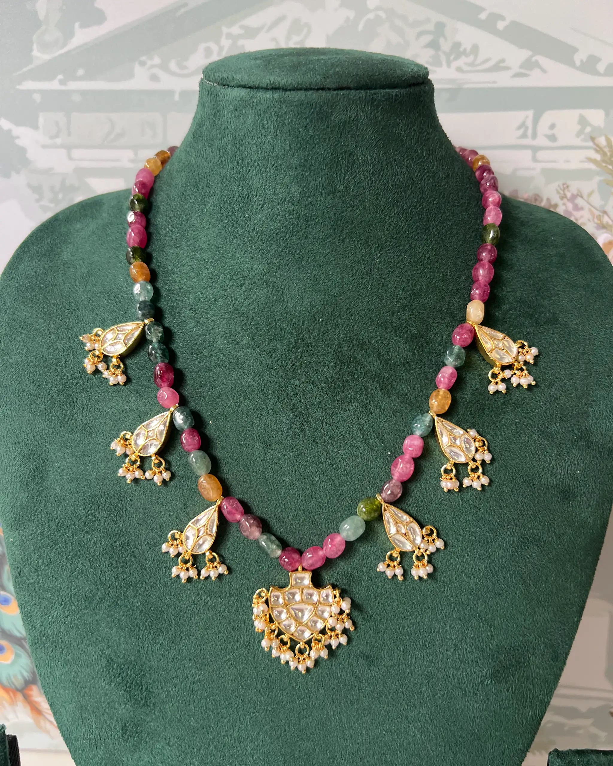 Multi-colour gemstone beaded necklace with five gold kundan teardrop drops and pearl fringe