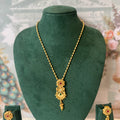 Gold necklace with floral pendant set with red and green stones, with matching drop earrings