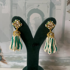 Green and white seed bead tassel jhumka earrings with white kundan polki stud and fluted gold bell