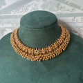 Antique gold Lakshmi temple choker with gold bead fringe and matching jhumkas