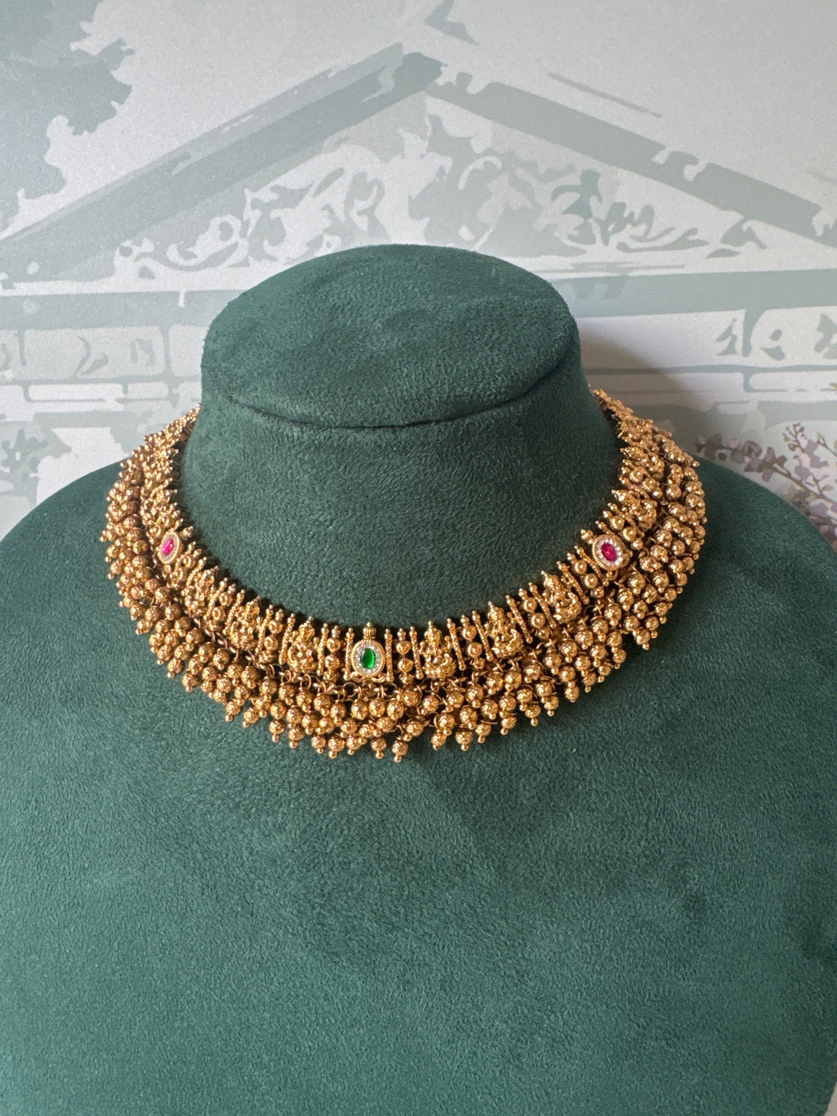 Antique gold Lakshmi temple choker with gold bead fringe and matching jhumkas