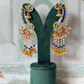 Royal blue kundan peacock ear cuff in gold with pearl-tipped rays and mini jhumka fringe