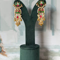 Pink and green kundan lotus drop earrings in gold with pearl-edged arch and ghungroo fringe