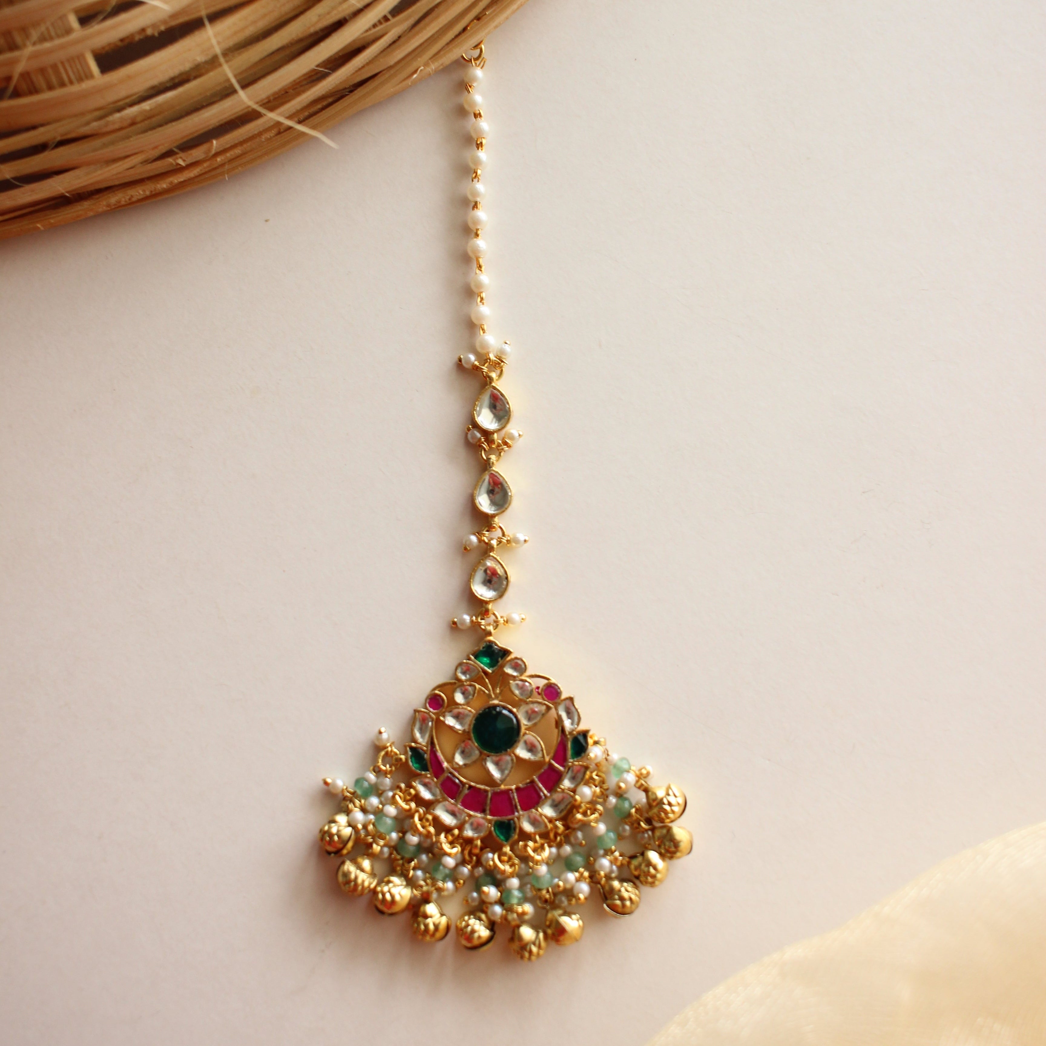 Antique Gold Kundan Maang Tikka – Peacock Fan Design with Emerald Center and Pearl Fringe