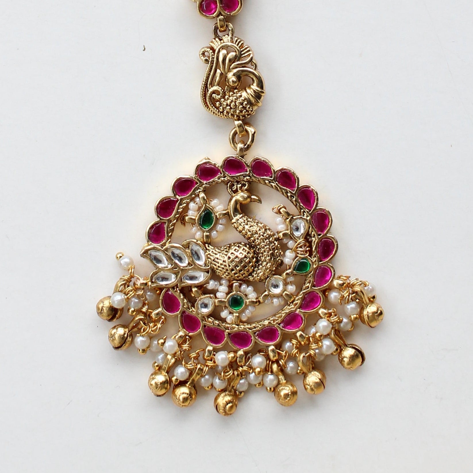 Antique Gold Peacock Maang Tikka – Ruby & Kundan Studded with Floral Charm Drop Chain