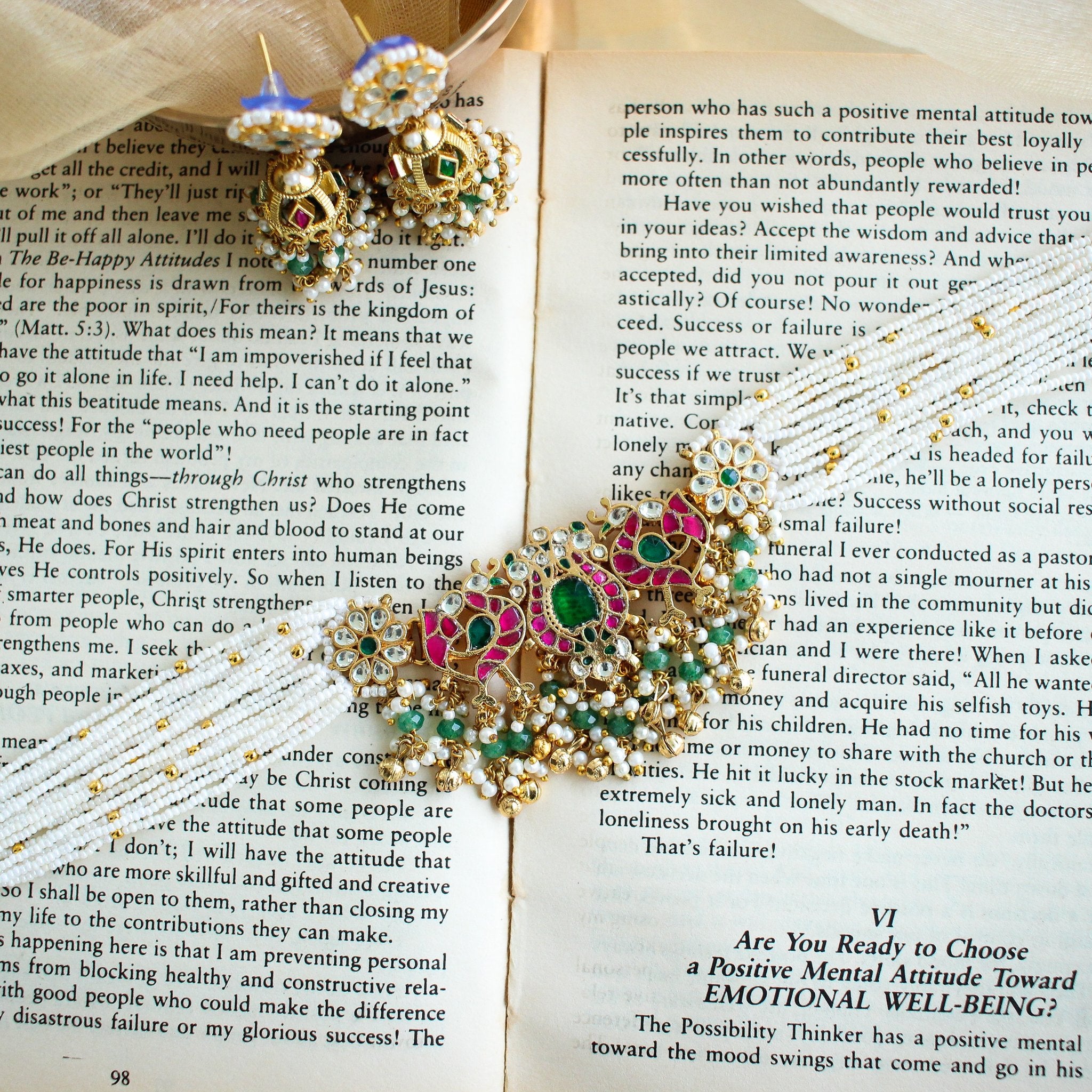 Full-length view of the multi-strand pearl choker with gold clasp